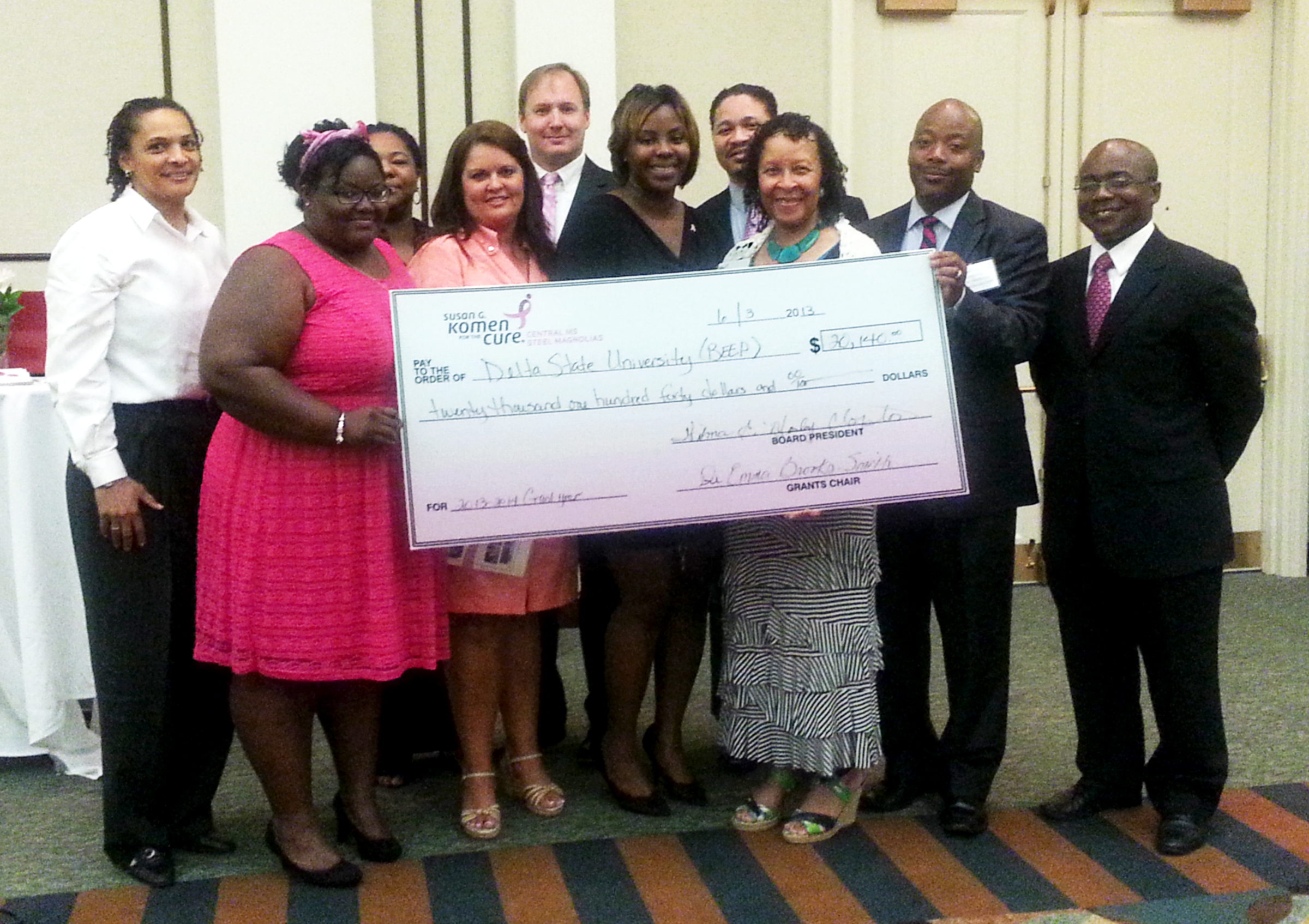 Photo: L to R: Back Row: Victoria Jackson, Director of Delta State University’s Center for Community and Economic Development, Kizmet Cleveland, B.E.E.P AmeriCorps*VISTA Member, Dr. Adrian Smith, Pink Tie Guy, Nic Lottt, Pink Tie Guy; Front Row: Taneisha Jackson, B.E.E.P AmeriCorps*VISTA Member, Christy Moore, Board Member, Jimisha Washington, B.E.E.P AmeriCorps*VISTA Member, Dr. Wilma Mosley Clopton, Board President, Michael Davis, Board Member and James Smith, Kroger Store Manager. 